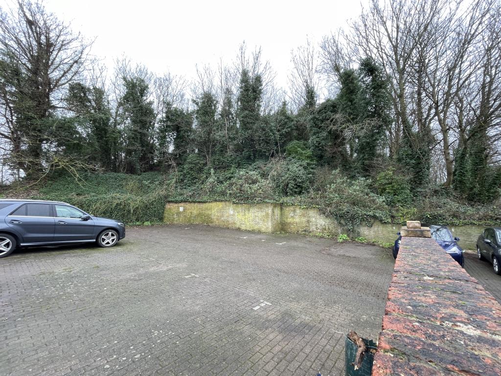 Lot: 16 - PARCEL OF WOODLAND - Outside view of western boundary from car park area facing east.